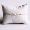Fijne armband met kleine parels en goudkleurige details