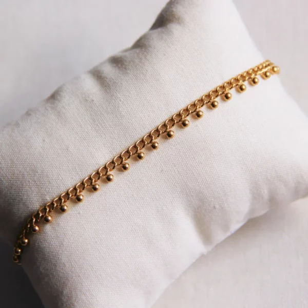 Enkelbandje met bolletjes in goud