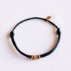 Satijnen armband met ringen in zwart en goud