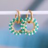 Oorbel met ronde facet hanger in groene tinten