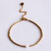 Kralenarmband met parel in goud