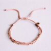 Viervoudige satijnen armband met kralen in oud roze