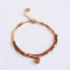 Drievoudige armband met hart en facetten in koraal