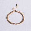 Schakelarmband met balletjes in goud