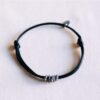 Satijnen armband met ringen in zwart en zilver