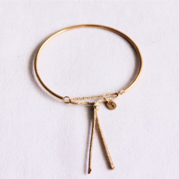 Armband met knoopdetail in goud en glitter